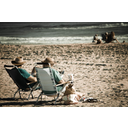 An_old_couple_relaxing_on_the_beach.jpg<>